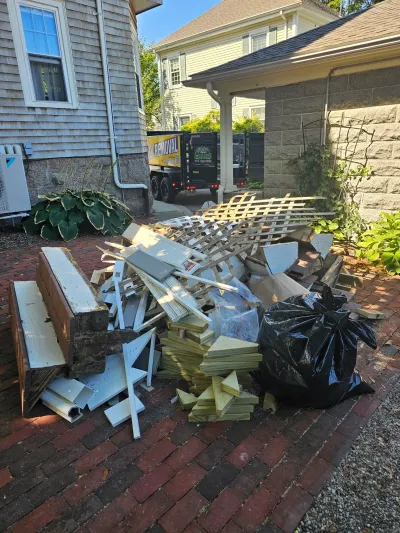 Lattice fencing and wood scraps removed from a renovation project near Wareham