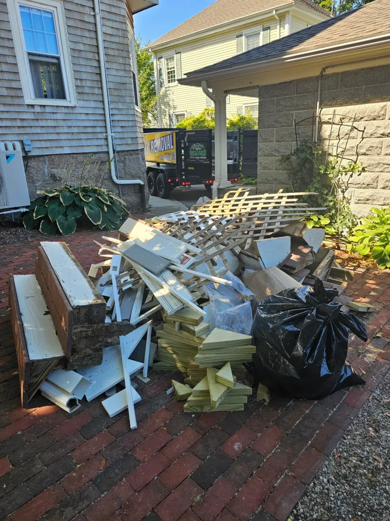 Lattice fencing and wood scraps removed from a renovation project near Wareham