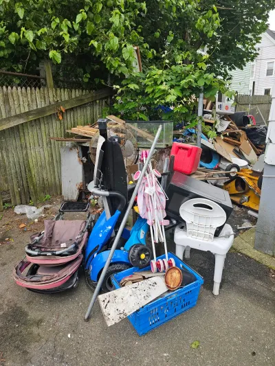 Mixed household junk set out for curbside pickup near Wareham MA
