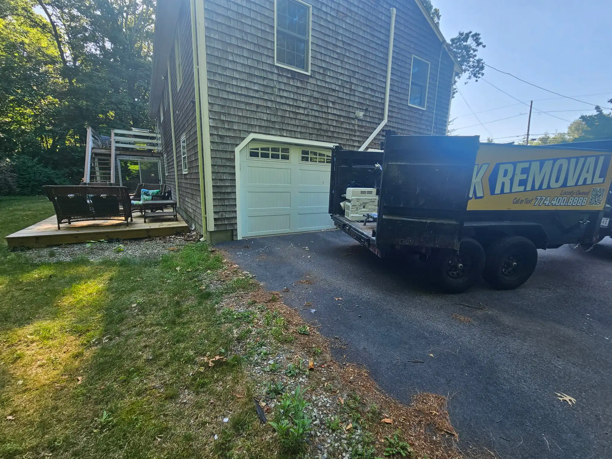 Dumpster rental placement in a tight residential driveway in South Coast
