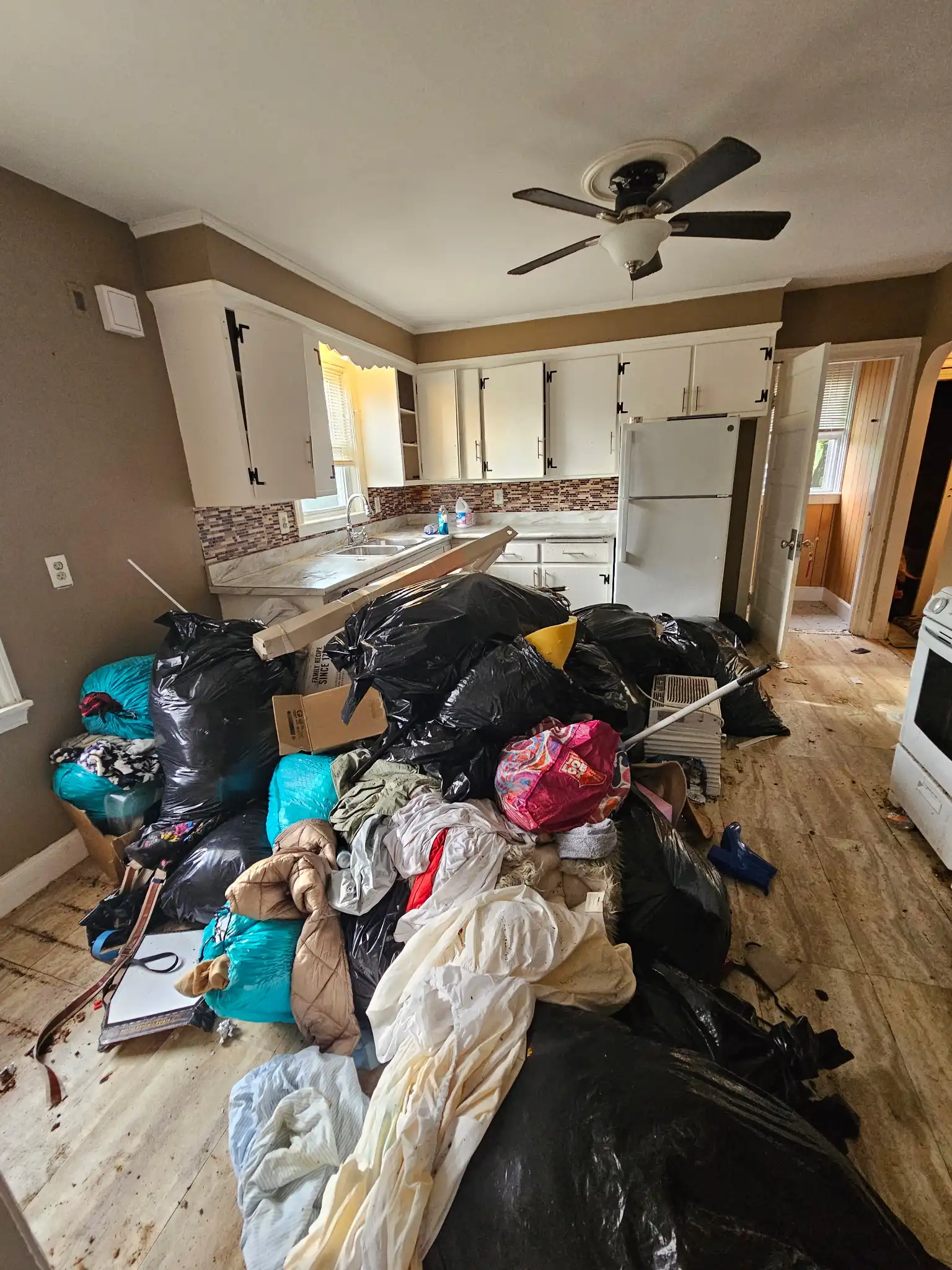 Apartment cleanout before starting cleanup in New Bedford