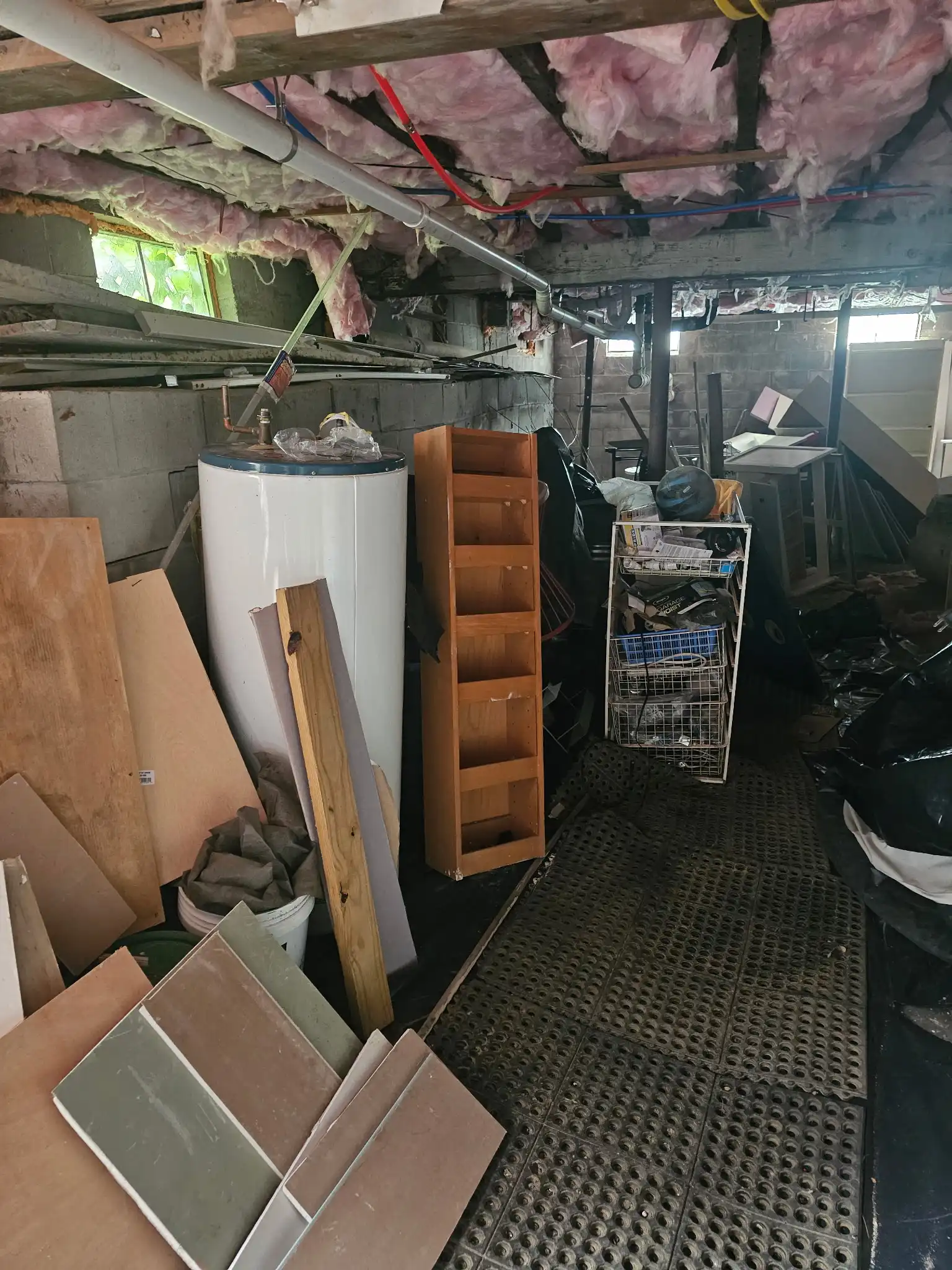 Basement corner filled with old materials before disposal