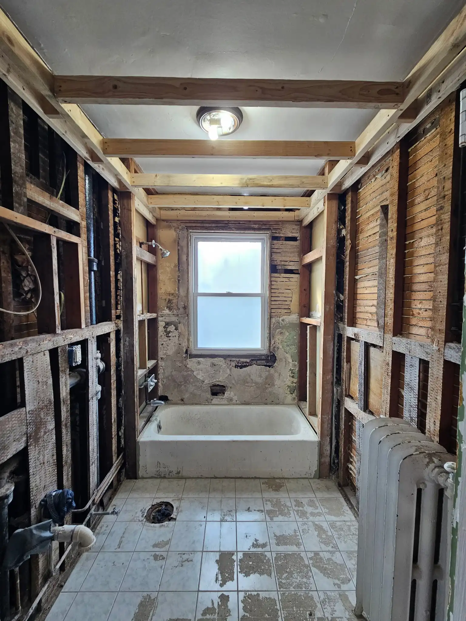 Bathroom after interior demolition - cleared to studs in New Bedford